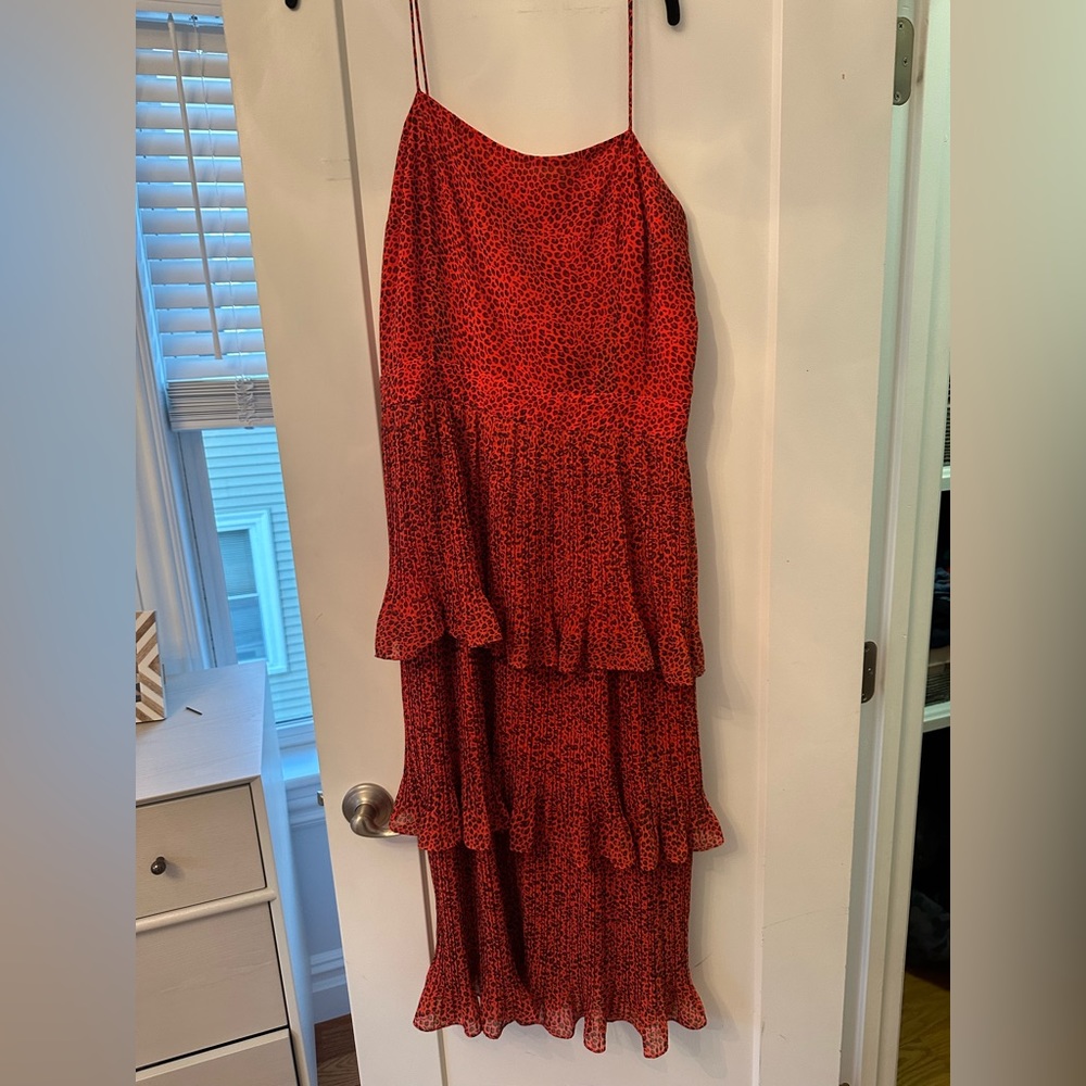 Whistle’s dress- bright orange with small black dots. Great ruffle detail